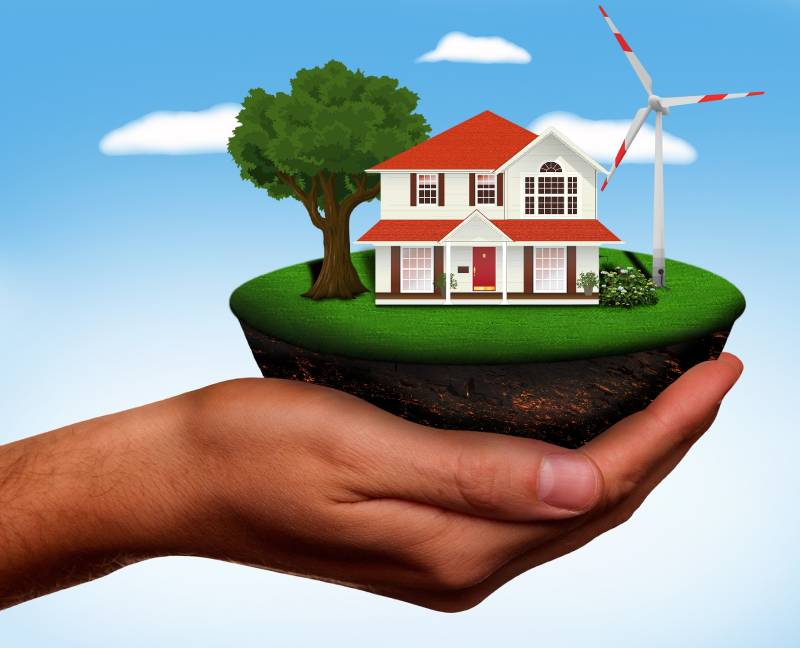 infografía de casa ecológica con energía eólica